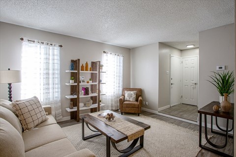 a living room with a couch and a table